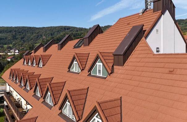 Captivating, natural stone coating makes the lightweight, strong metal GERARD roof an attractive roofing solution.